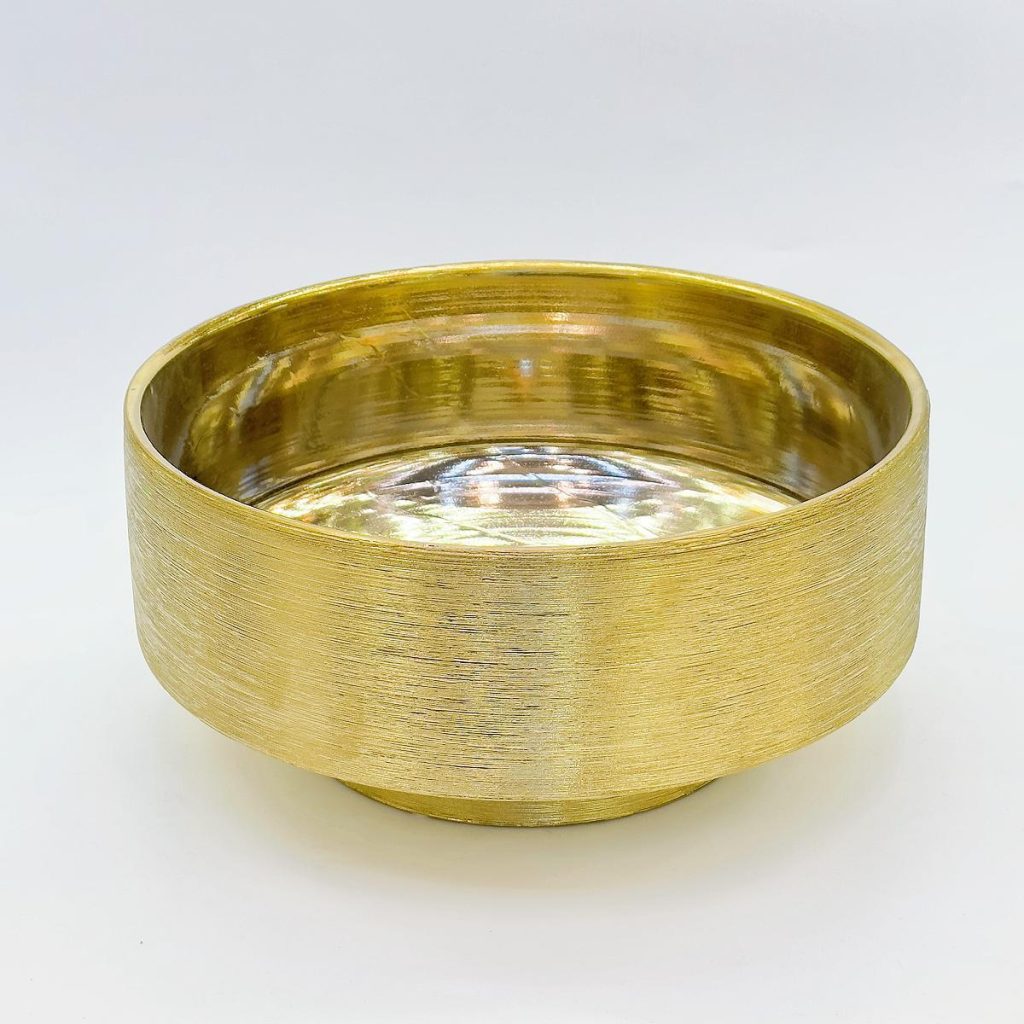 Electroplated golden ceramic container